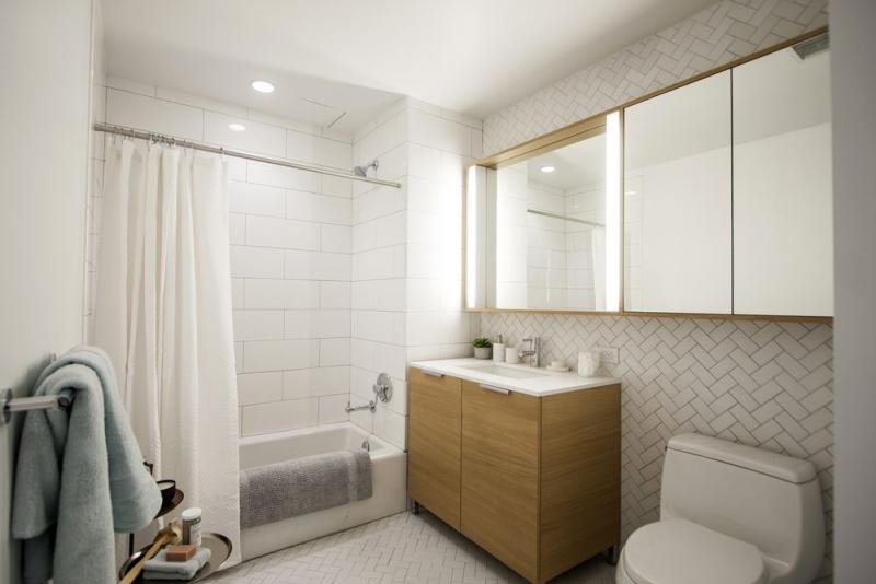 Via 57 West Case Study - Custom White Herringbone Tile Bathroom Installation