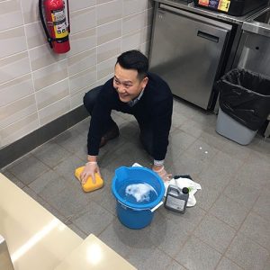 Ken Ahn cleaning tile