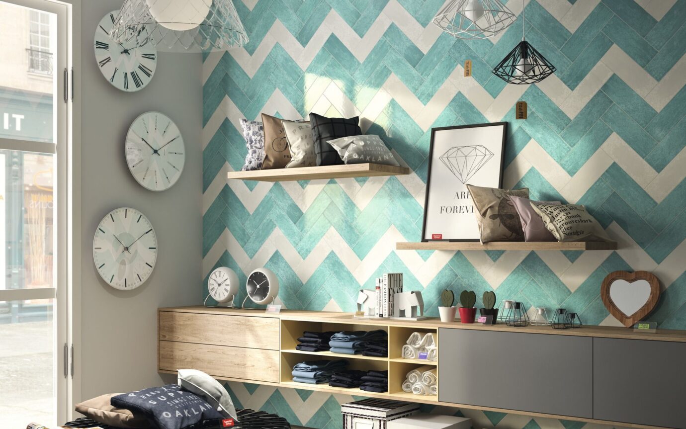 Alternating herringbone pattern of aqua and cream tiles