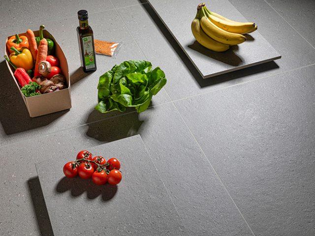 fruits and vegetables sitting on gray tile