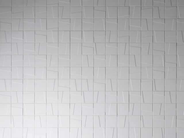 white square textured tile wall