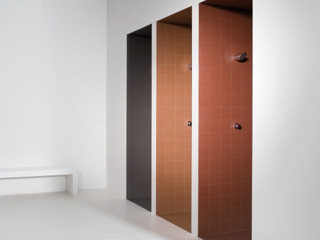 brown, tan, and orange square tiled showers