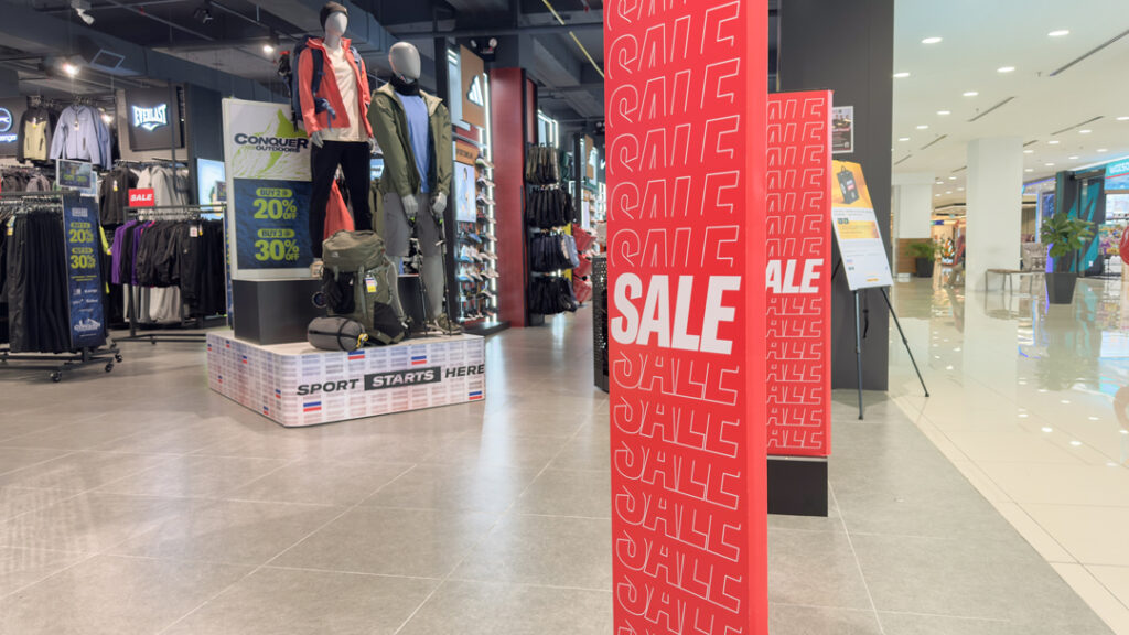 retail store display promoting sale with vibrant signage and organized merchandise